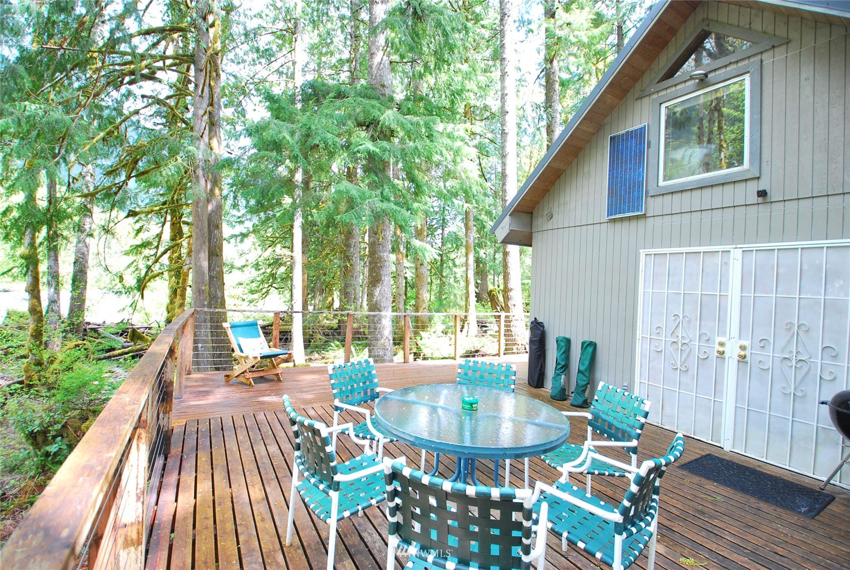 16128 Index-Galena Road Index, WA 98256 - Photo 6 of 35 a view of a patio with couches table and chairs and potted plants