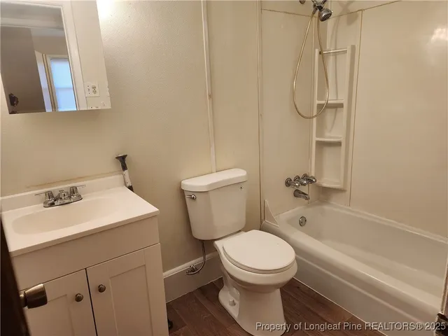 a kitchen with a refrigerator a stove a microwave and cabinets