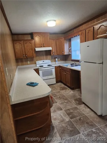 a view of a room with a large window and front door