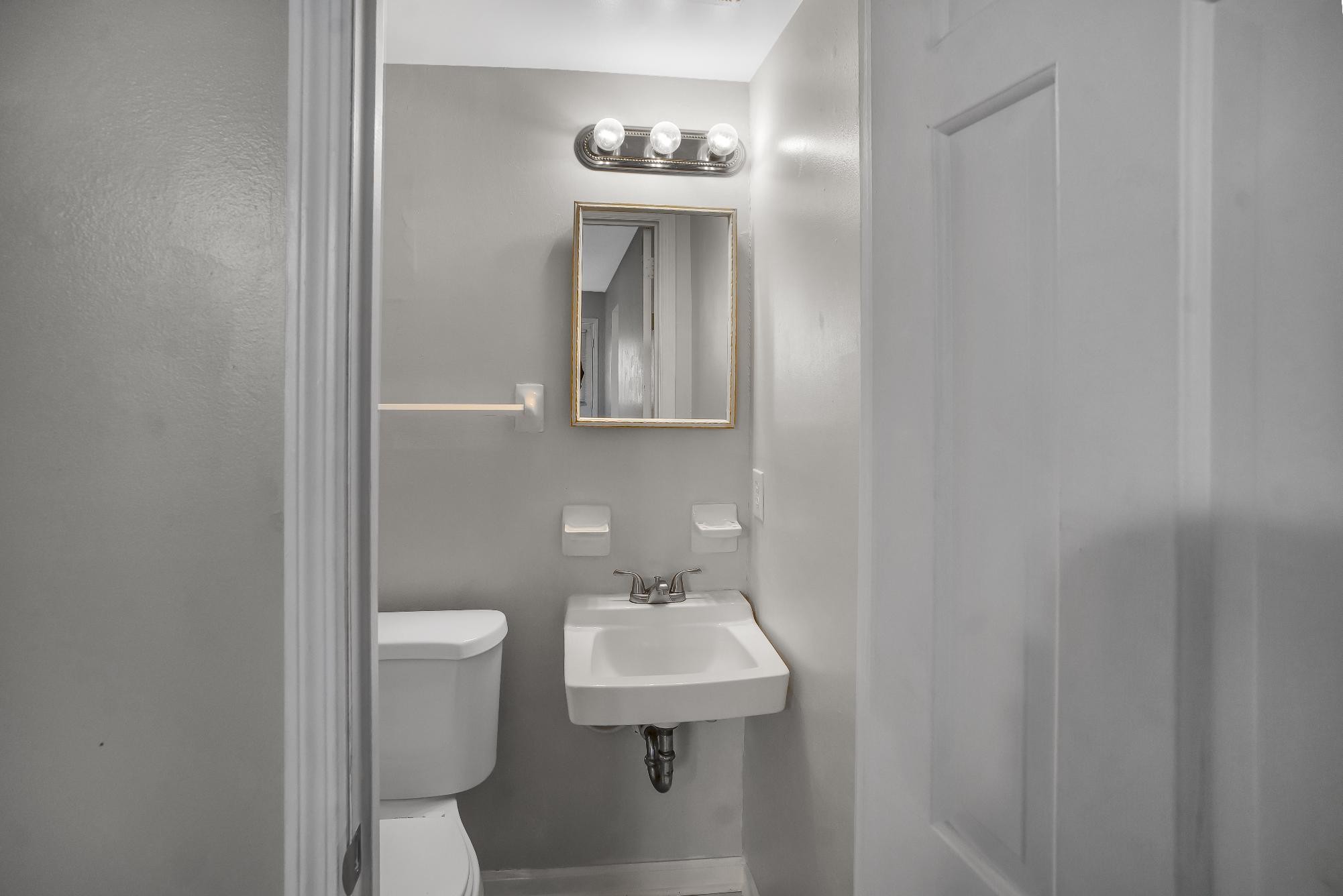 1301 Neelys Bend Road, Unit 73 Madison, TN 37115 - Photo 17 of 17 a bathroom with a sink a toilet and mirror