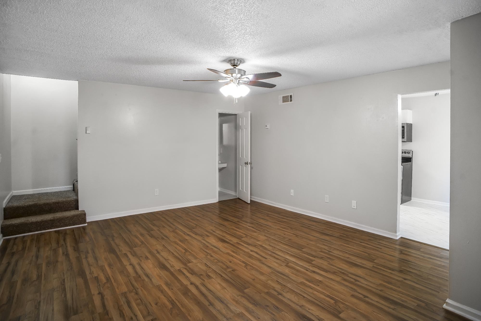 1301 Neelys Bend Road, Unit 73 Madison, TN 37115 - Photo 4 of 17 a view of an empty room with wooden floor