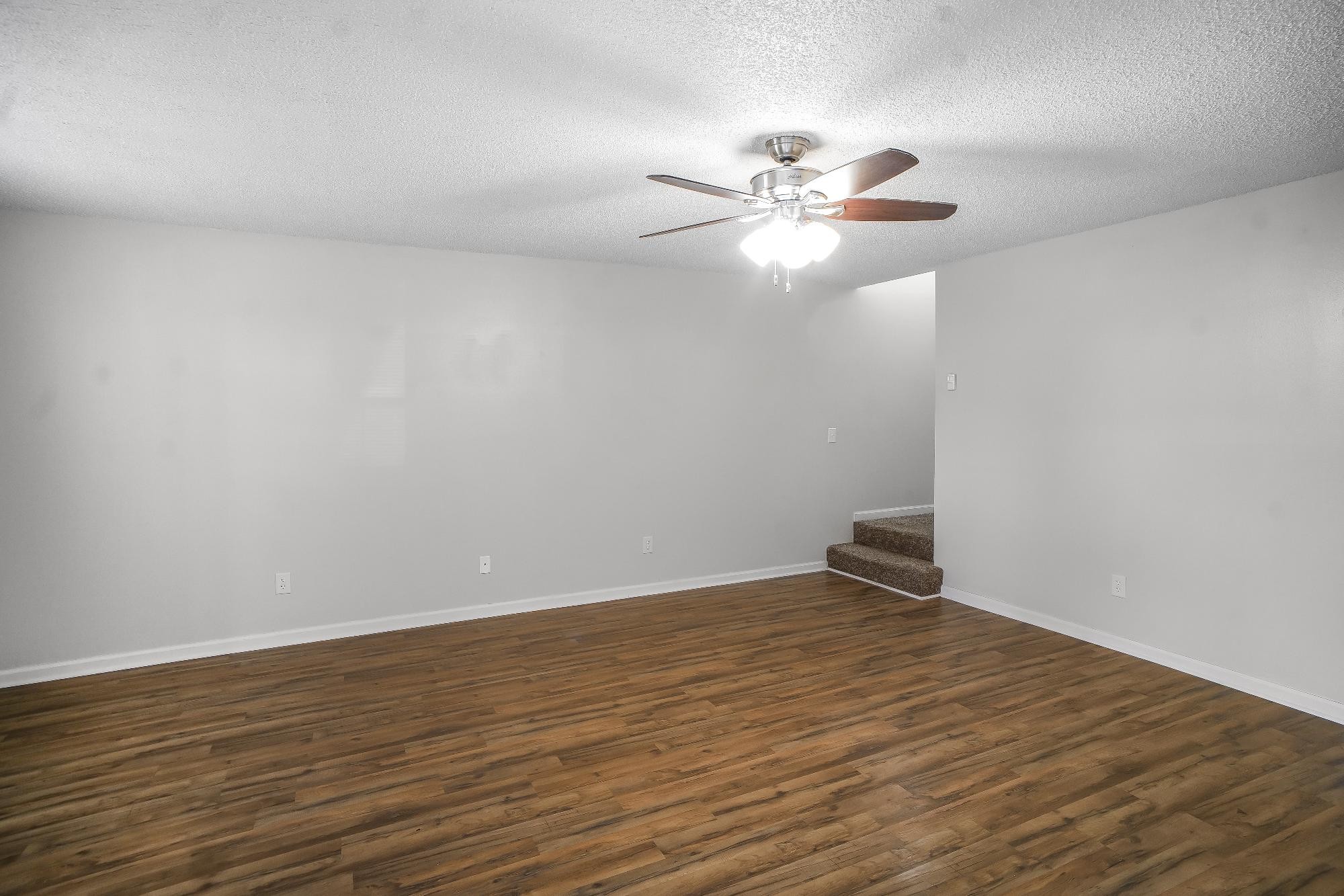 1301 Neelys Bend Road, Unit 73 Madison, TN 37115 - Photo 6 of 17 a view of an empty room with wooden floor