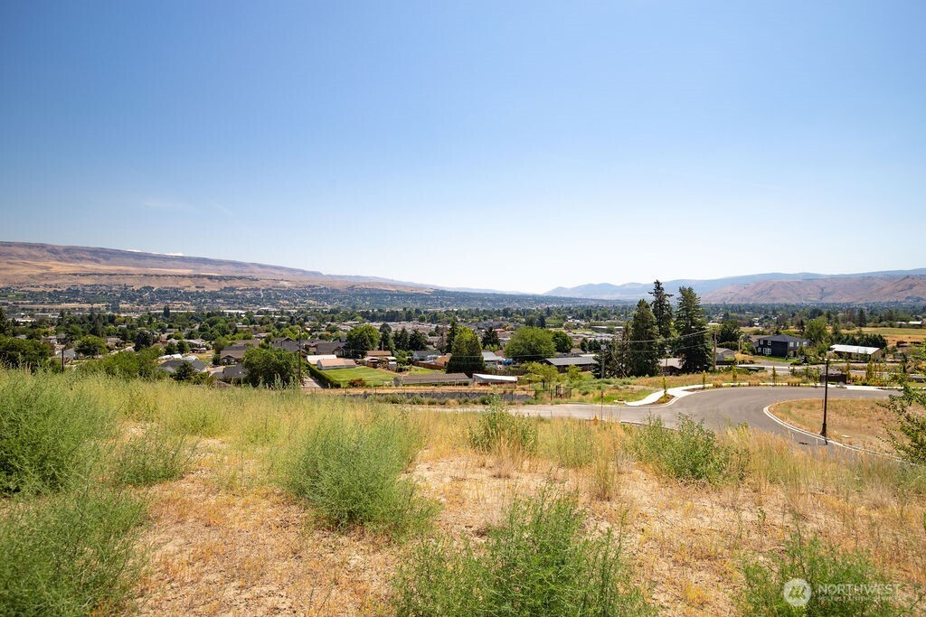 0 Ridgefield Way Wenatchee, WA 98801 - Photo 23 of 24 a view of a lake with houses in the back