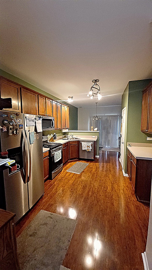 17543 Gilbert Drive Lockport, IL 60441 - Photo 13 of 54 a large kitchen with a sink cabinets and stainless steel appliances