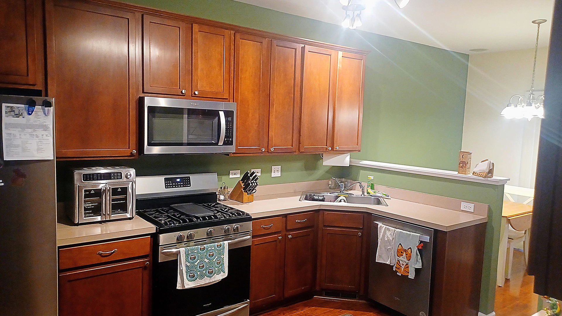 17543 Gilbert Drive Lockport, IL 60441 - Photo 15 of 54 a kitchen with stainless steel appliances granite countertop a stove a sink and a microwave