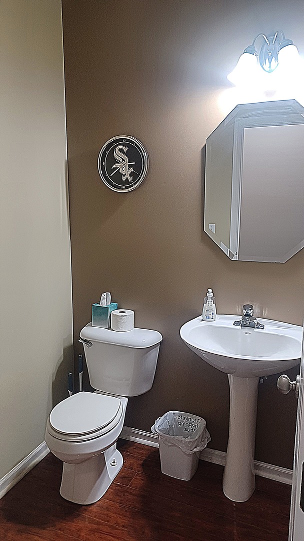 17543 Gilbert Drive Lockport, IL 60441 - Photo 21 of 54 a white toilet sitting next to a bathroom sink