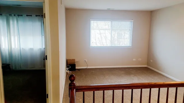a view of a hallway with windows