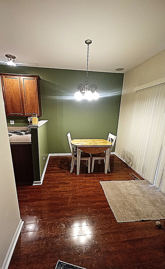 17543 Gilbert Drive Lockport, IL 60441 - Photo 10 of 54 a living room with chairs piano and wooden floor