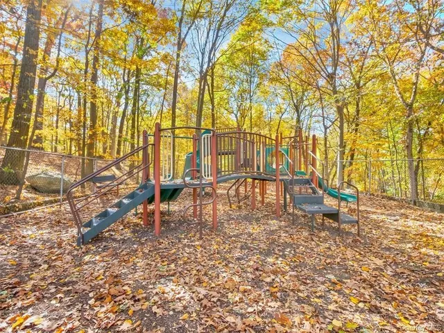 a view of yard with swimming pool