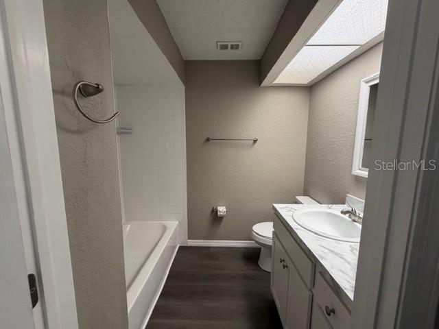 4400 Millwood Road, Unit E Spring Hill, FL 34608 - Photo 12 of 21 a bathroom with a sink a toilet and shower