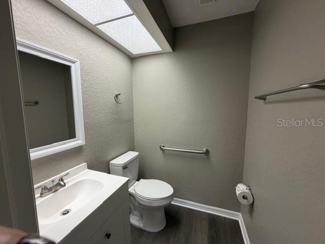 4400 Millwood Road, Unit E Spring Hill, FL 34608 - Photo 20 of 21 a white toilet sitting next to a bathroom sink
