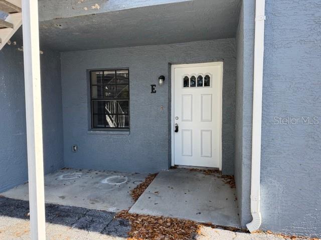 4400 Millwood Road, Unit E Spring Hill, FL 34608 - Photo 2 of 21 a view of a hallway with entryway