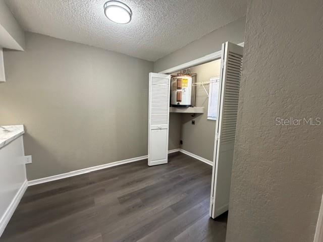 4400 Millwood Road, Unit E Spring Hill, FL 34608 - Photo 6 of 21 an empty room with wooden floor closet and windows