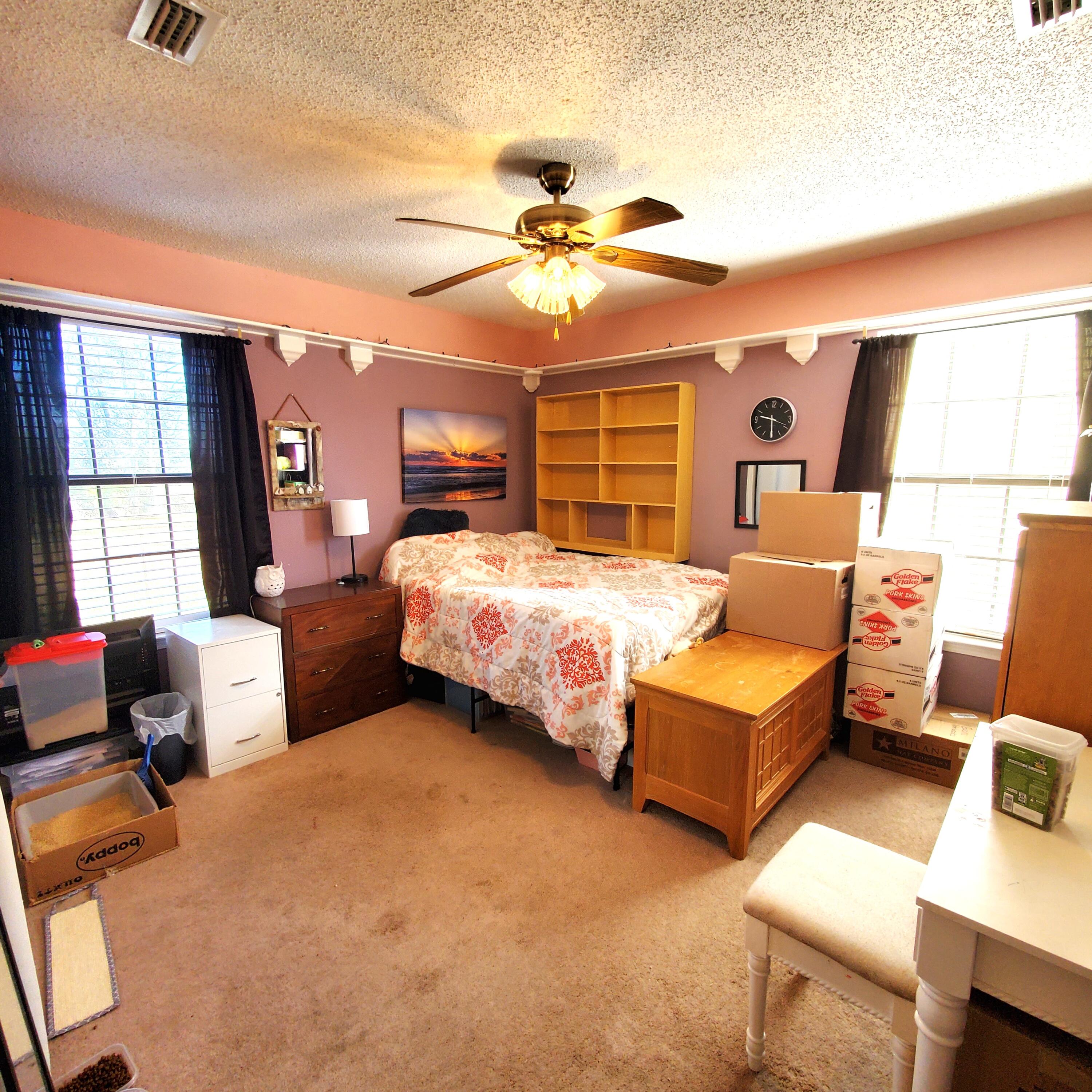 6060 Old Bethel Road Crestview, FL 32536 - Photo 13 of 25 a bedroom with a bed and wooden floor