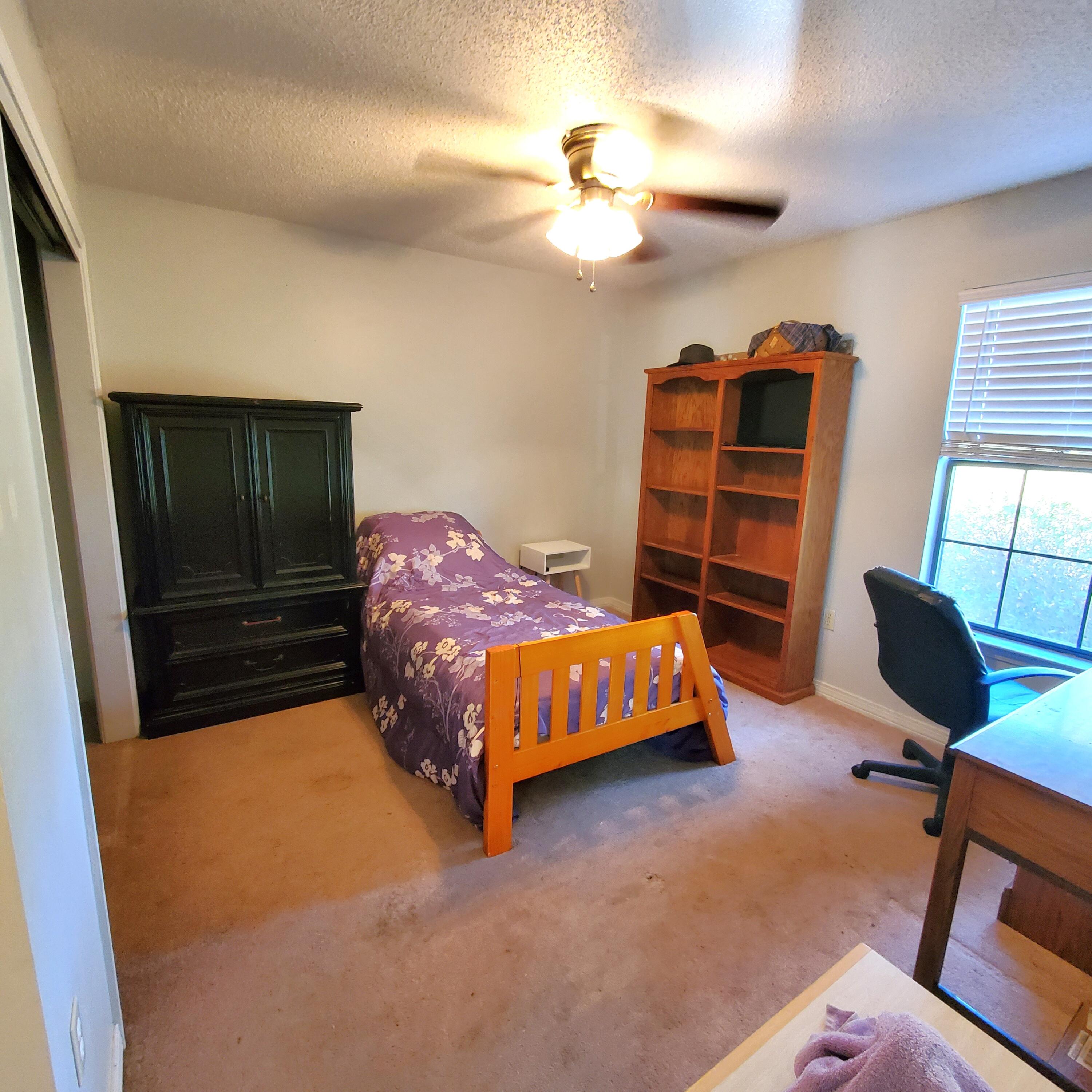 6060 Old Bethel Road Crestview, FL 32536 - Photo 15 of 25 a bedroom with a bed and window