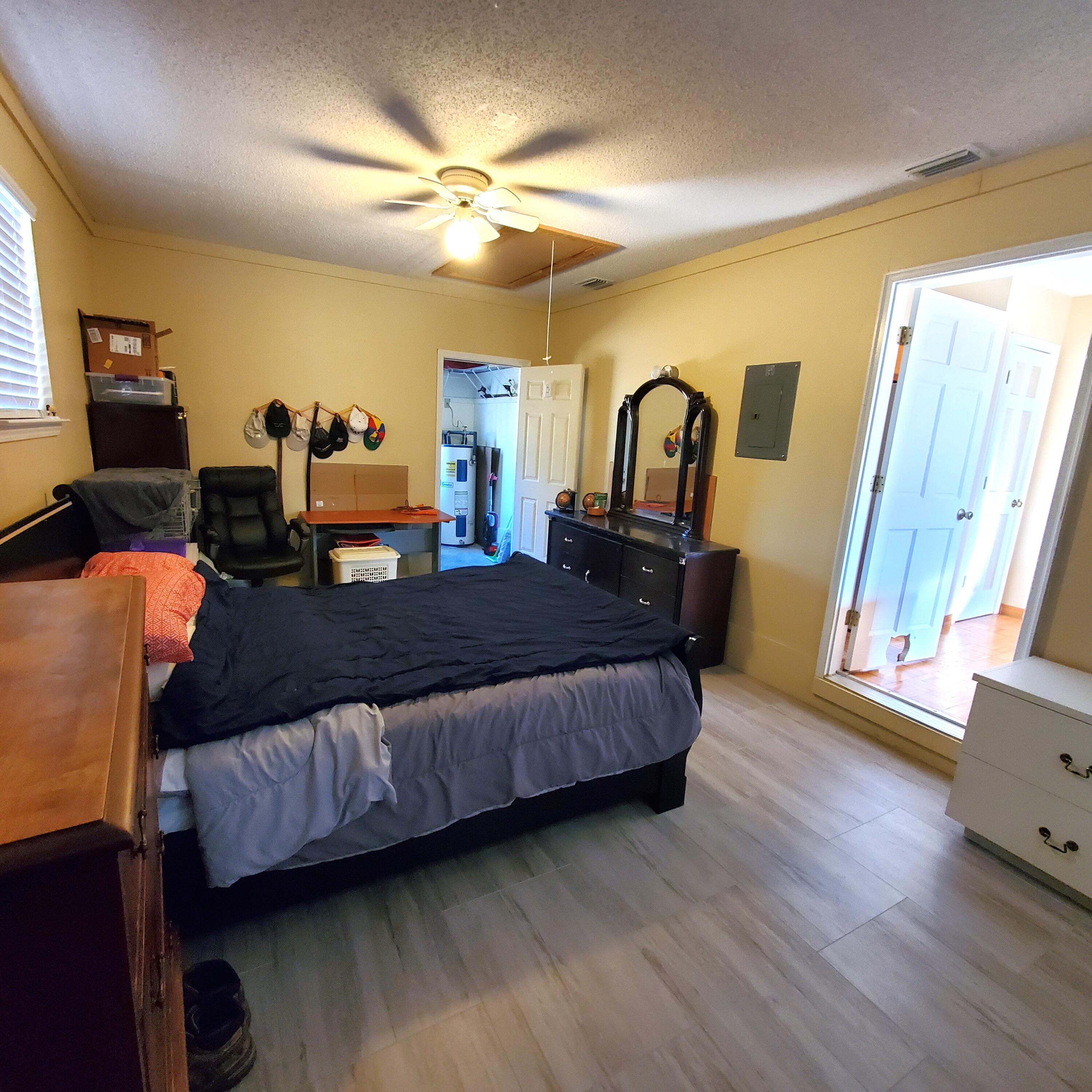 6060 Old Bethel Road Crestview, FL 32536 - Photo 18 of 25 a living room with furniture and wooden floor