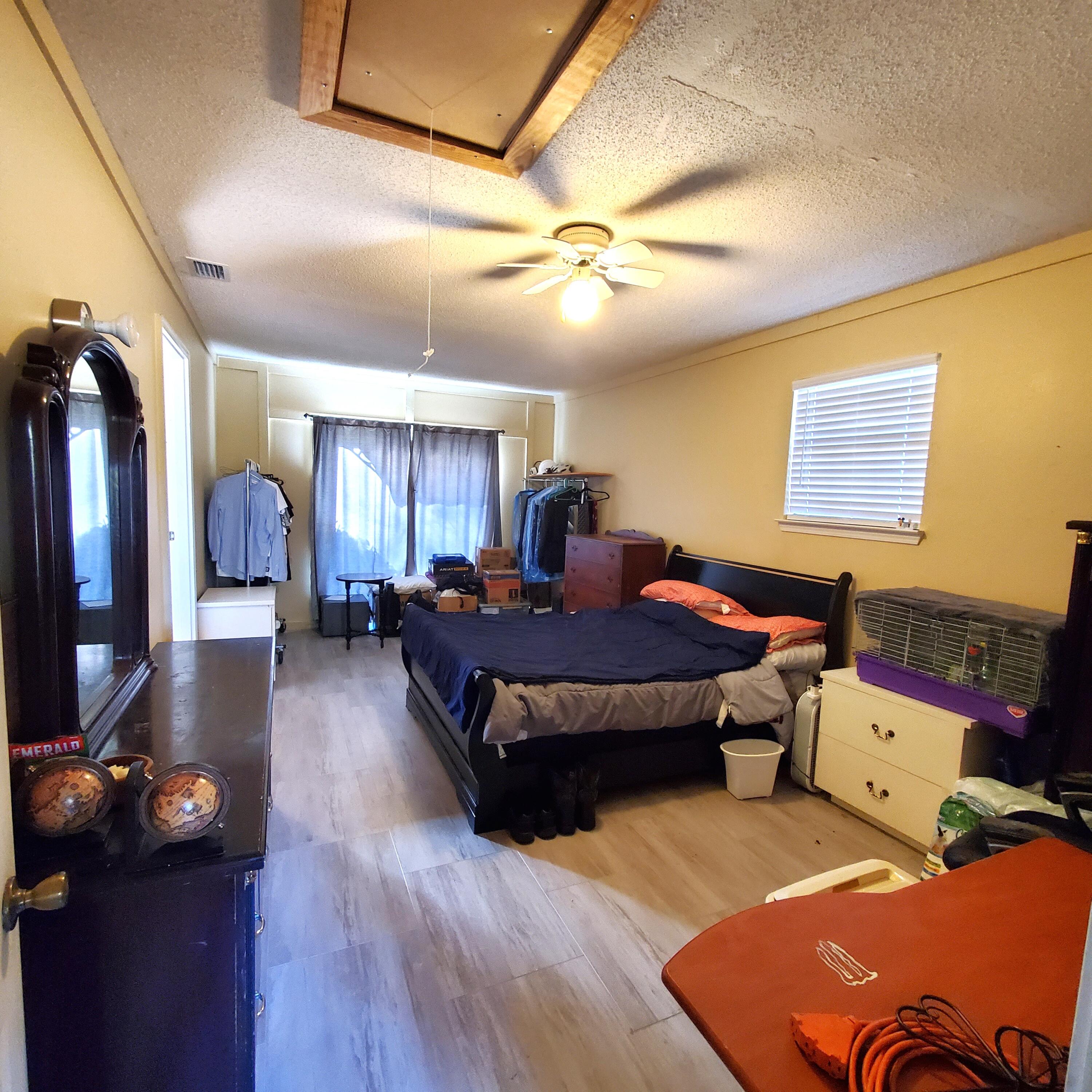 6060 Old Bethel Road Crestview, FL 32536 - Photo 19 of 25 a bed room with a bed window and dresser