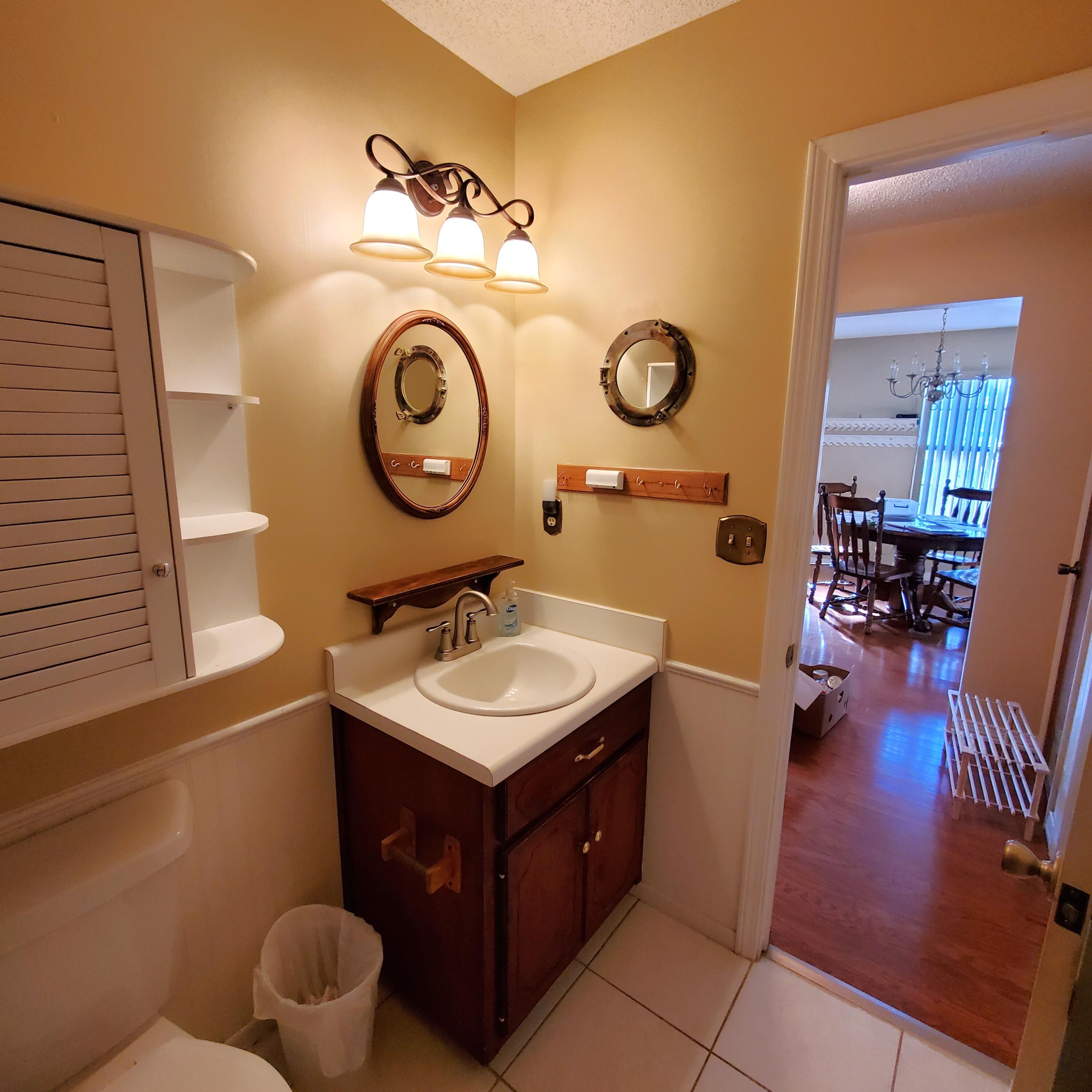 6060 Old Bethel Road Crestview, FL 32536 - Photo 20 of 25 a bathroom with a sink and a mirror