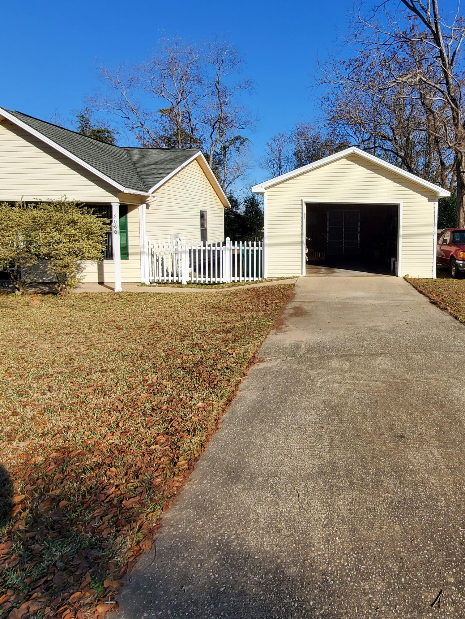 6060 Old Bethel Road Crestview, FL 32536 - Photo 22 of 25 a view of a house with a yard and balcony