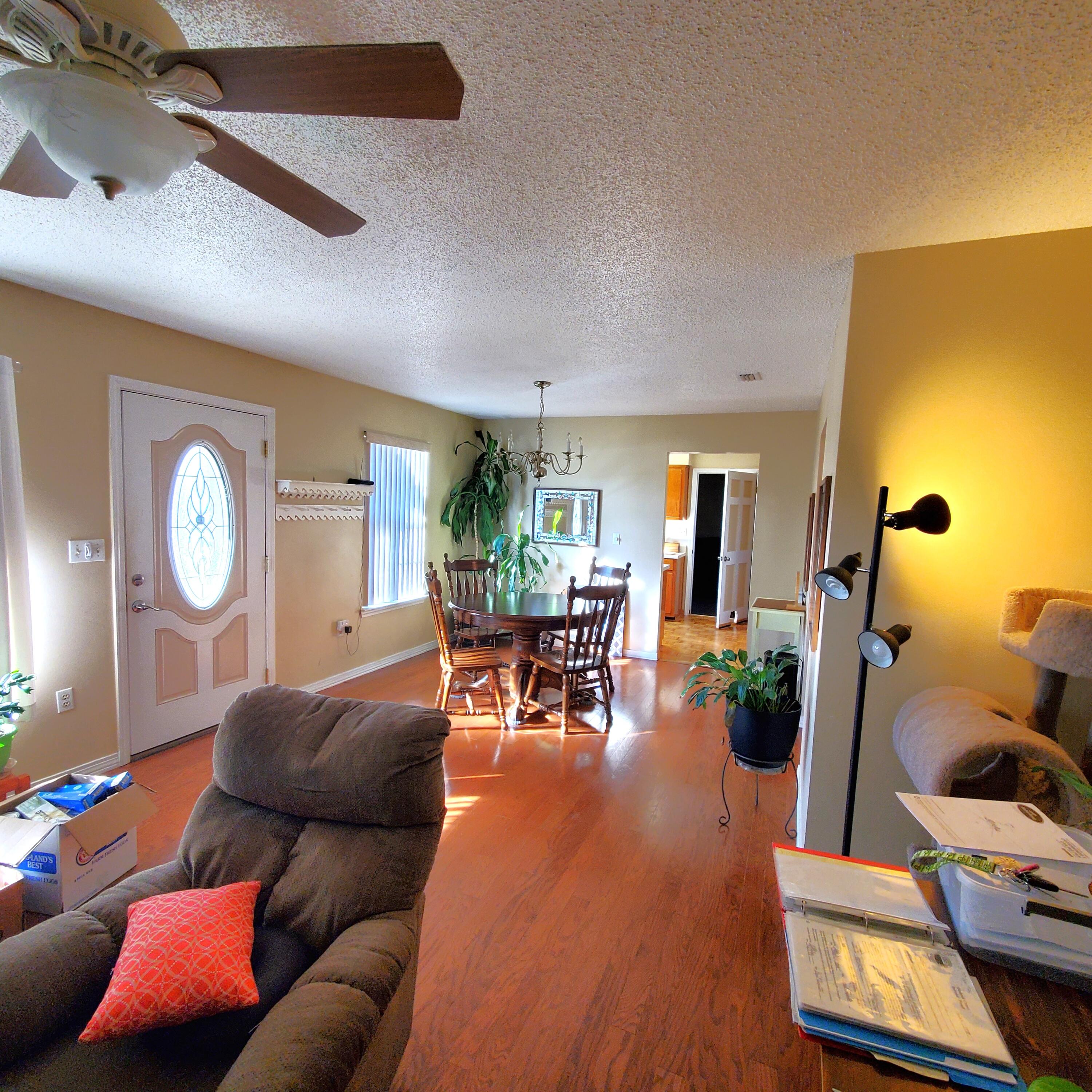 6060 Old Bethel Road Crestview, FL 32536 - Photo 3 of 25 a living room with furniture and wooden floor