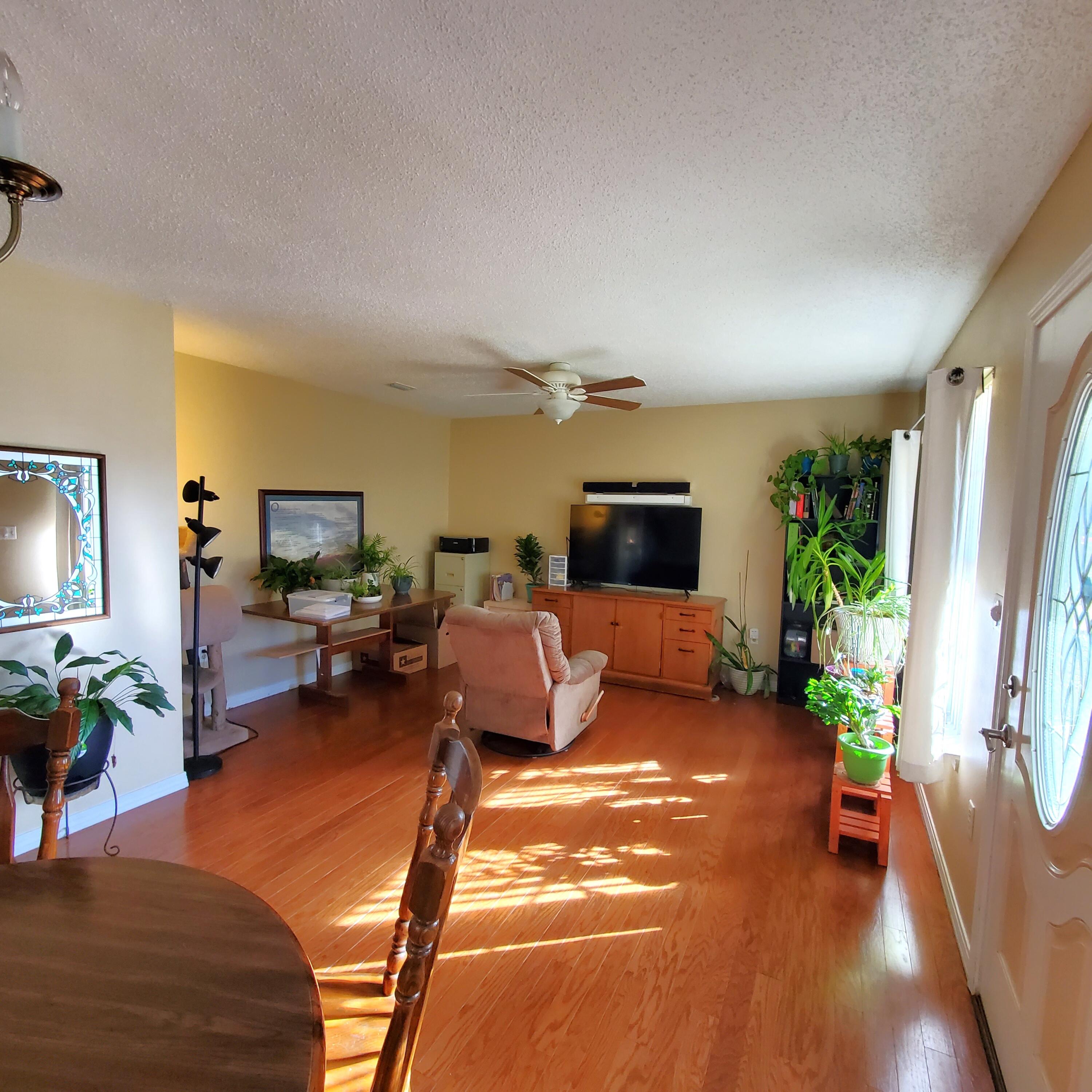 6060 Old Bethel Road Crestview, FL 32536 - Photo 4 of 25 a living room with furniture and a flat screen tv