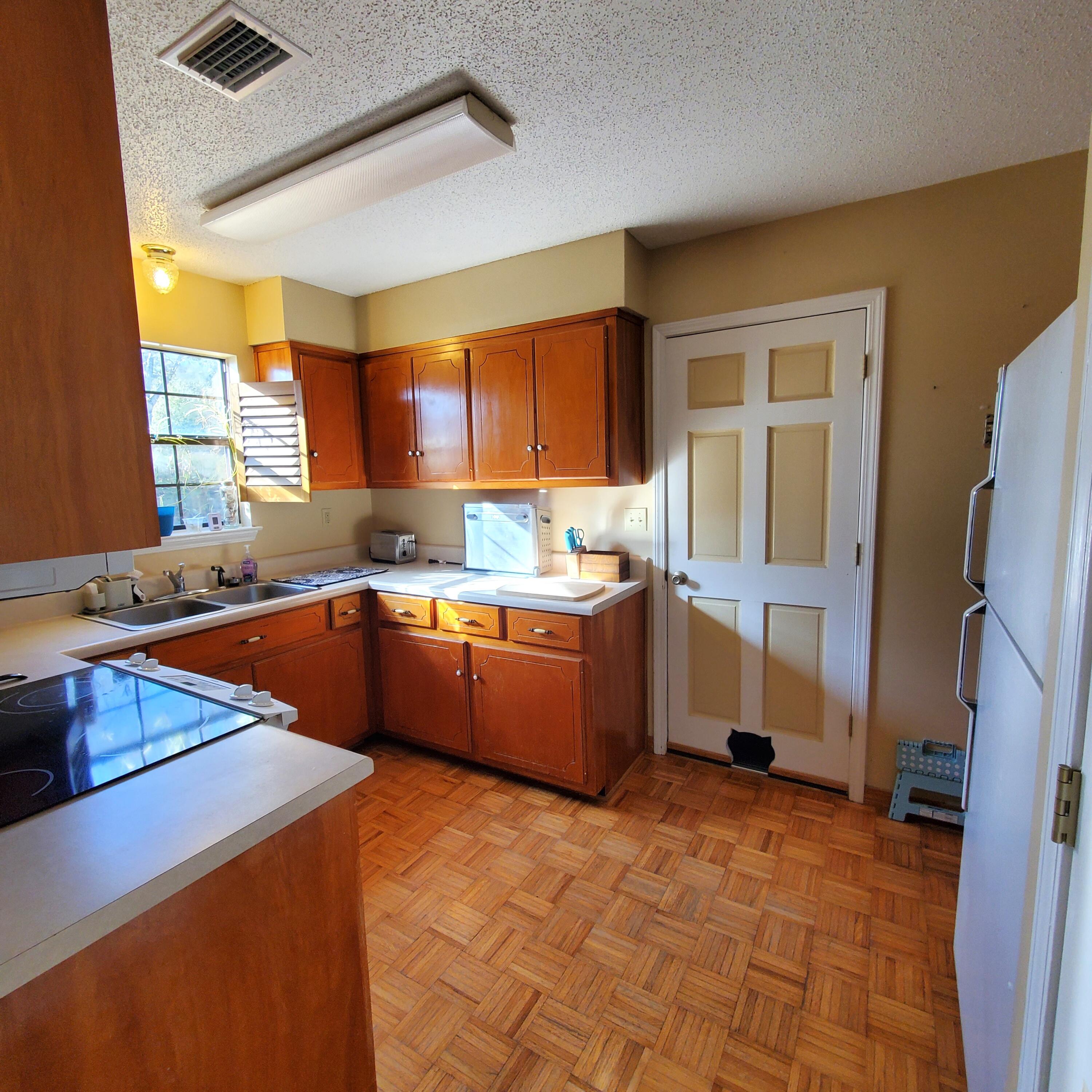 6060 Old Bethel Road Crestview, FL 32536 - Photo 10 of 25 a kitchen with stainless steel appliances granite countertop a sink stove and refrigerator