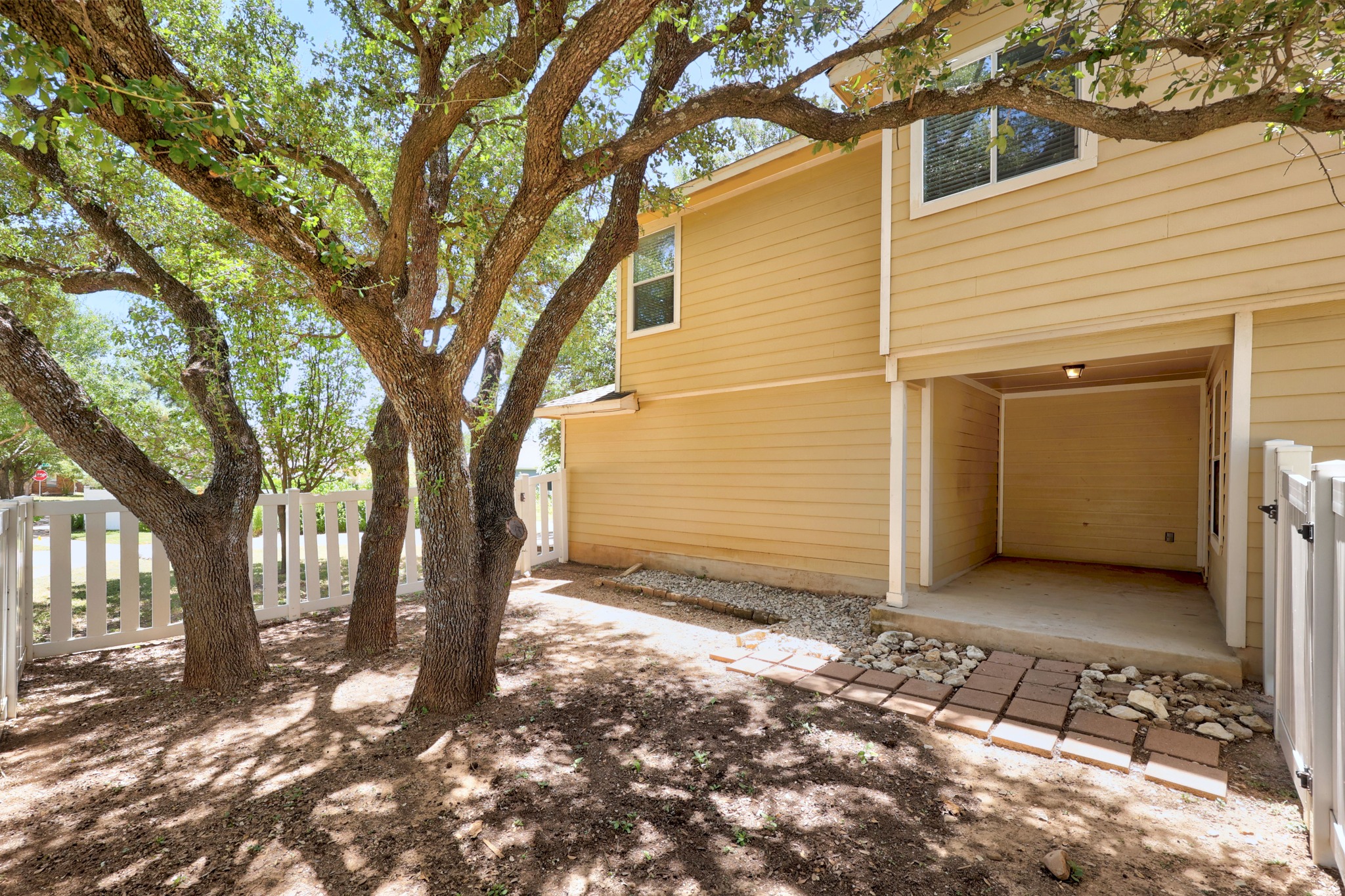 1818 Lost Maples Loop Cedar Park, TX 78613 - Photo 25 of 38 Mature trees offer shade to this inviting outdoor space, complete with a cozy covered patio.