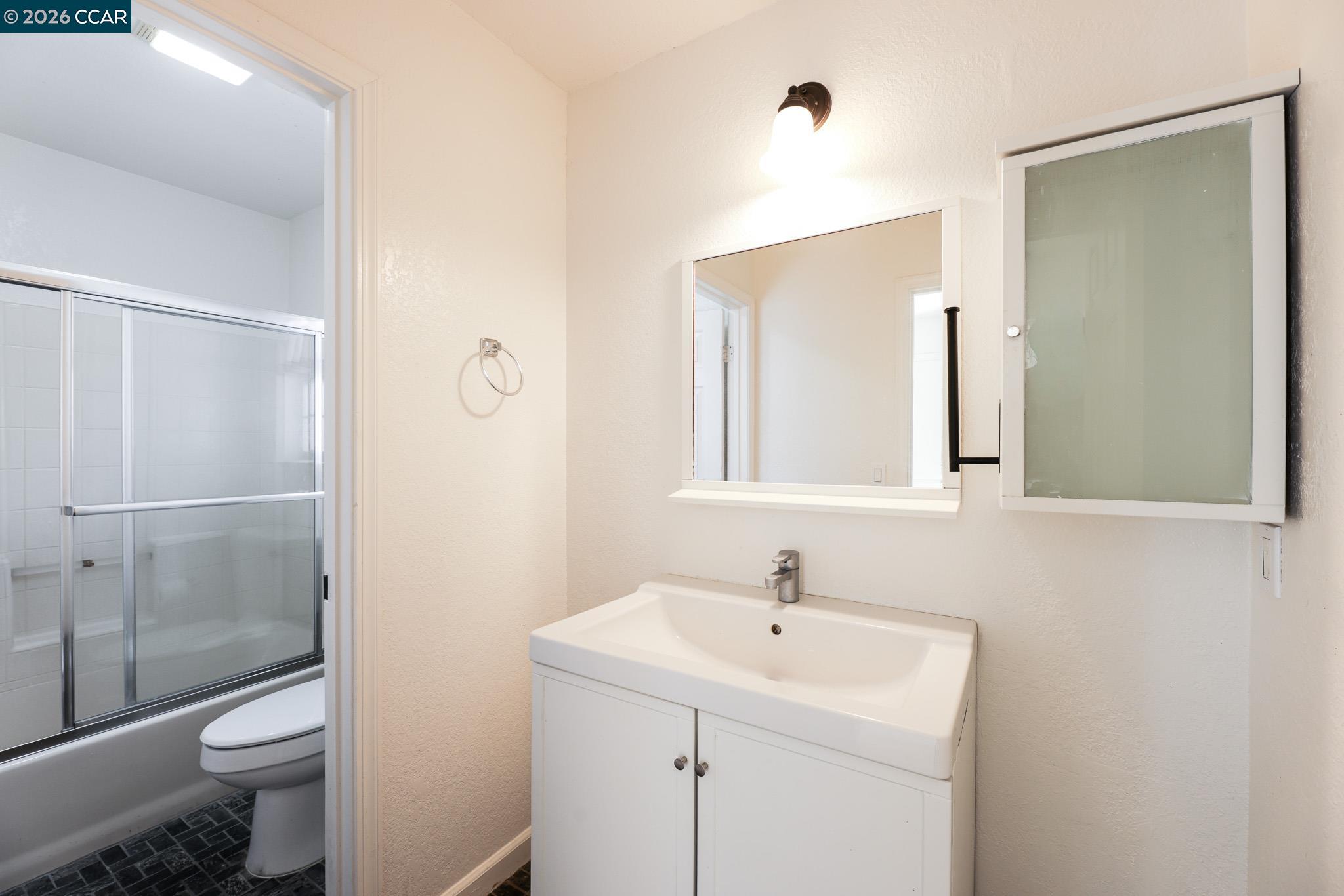528 Dohrmann Lane Pinole, CA 94564 - Photo 17 of 27 a bathroom with a sink a toilet and shower