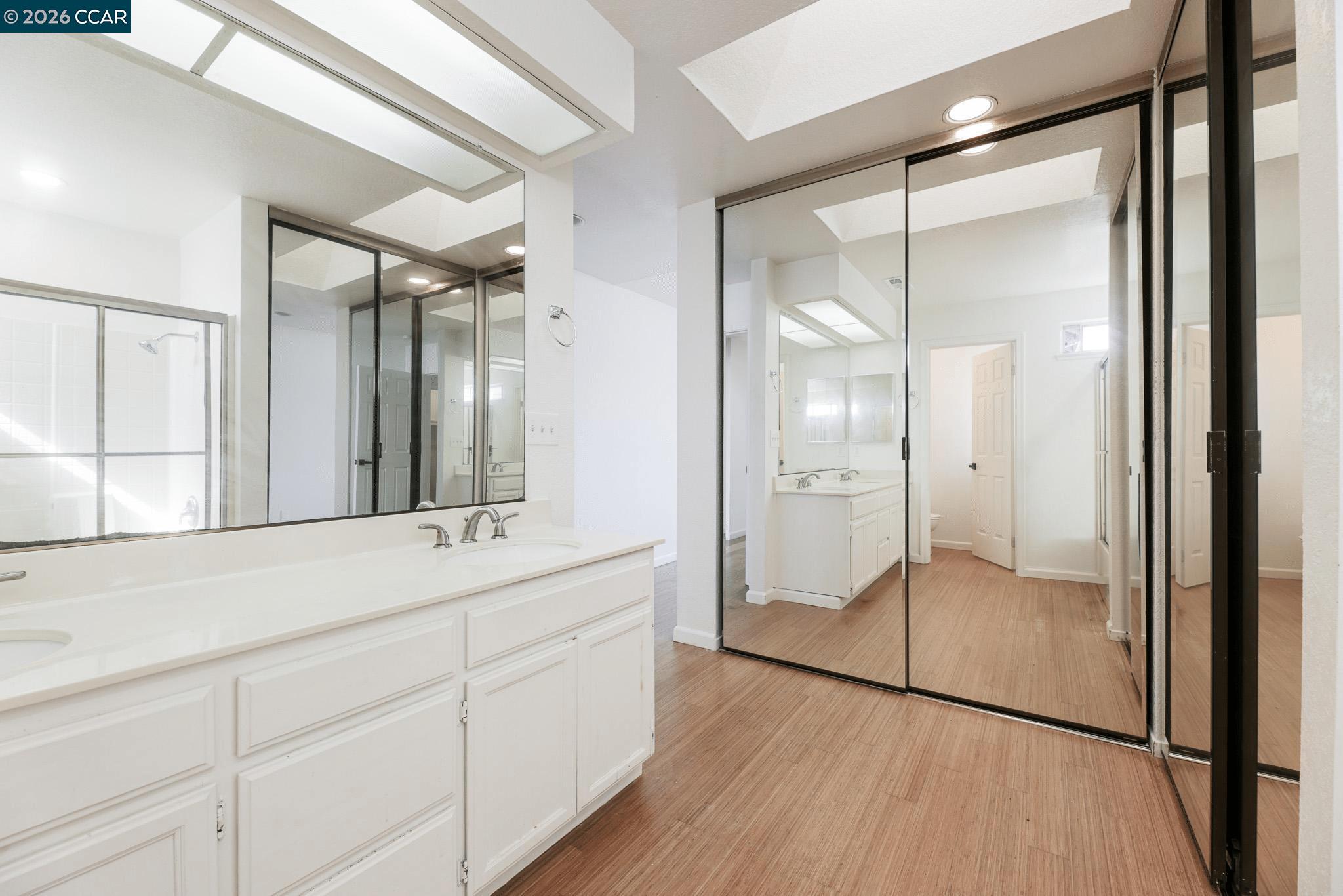 528 Dohrmann Lane Pinole, CA 94564 - Photo 22 of 27 a bathroom with a double vanity sink mirror and shower