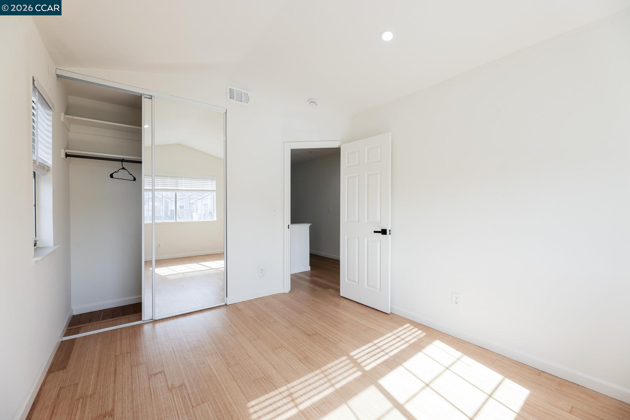 528 Dohrmann Lane Pinole, CA 94564 - Photo 23 of 27 a view of a room with an empty space and wooden floor
