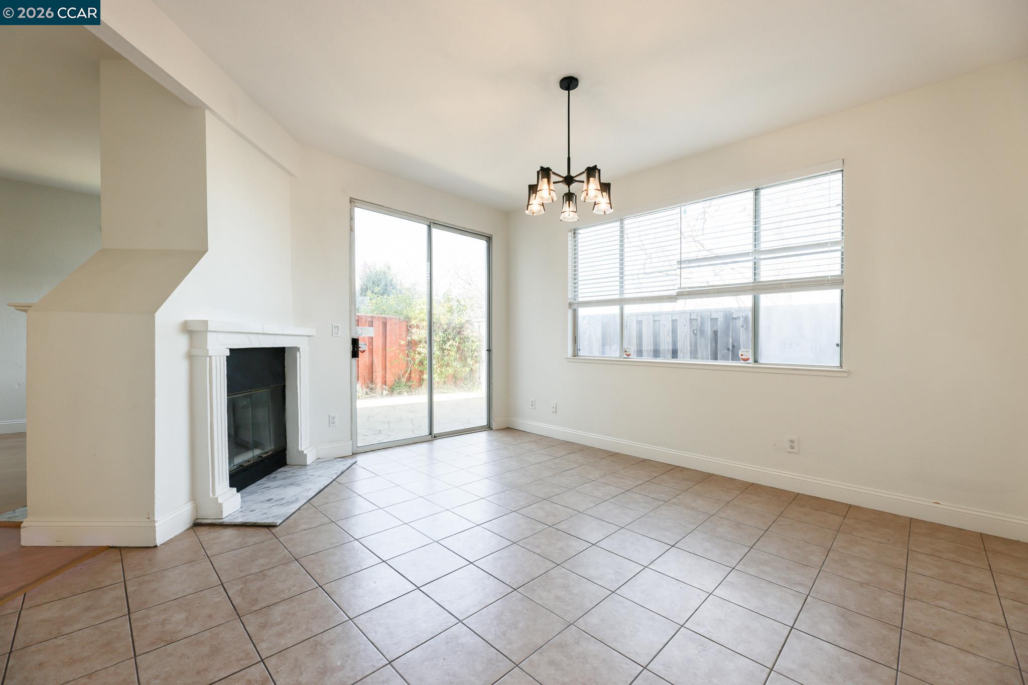 528 Dohrmann Lane Pinole, CA 94564 - Photo 8 of 27 a view of an empty room with window and chandelier