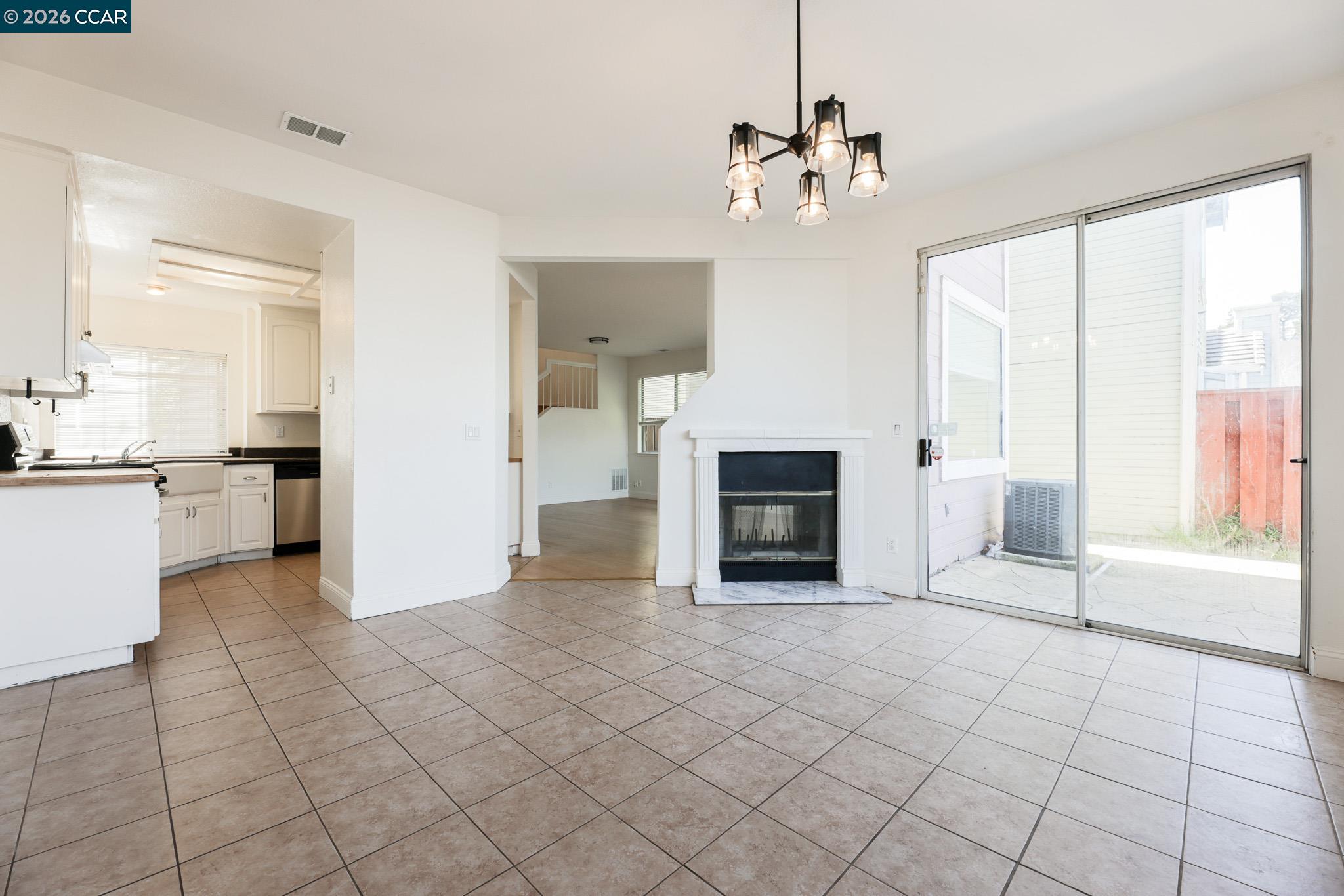 528 Dohrmann Lane Pinole, CA 94564 - Photo 9 of 27 a view of a kitchen with furniture and a fireplace