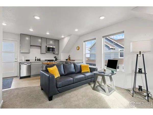 a living room with a couch and a flat screen tv