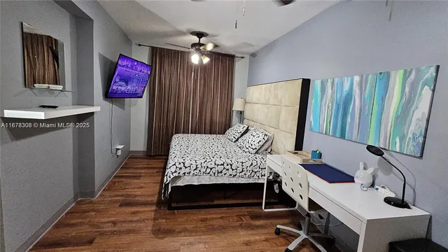 a bedroom with a bed dresser and a window