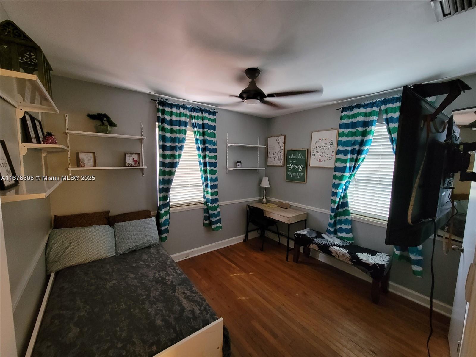 3600 Southwest S Le Jeune Road, Unit 3600 Coral Gables, FL 33134 - Photo 24 of 25 a room with furniture and a window