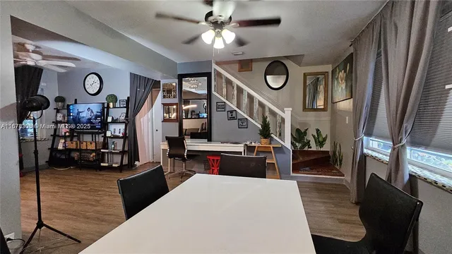 a view of living room kitchen and entryway