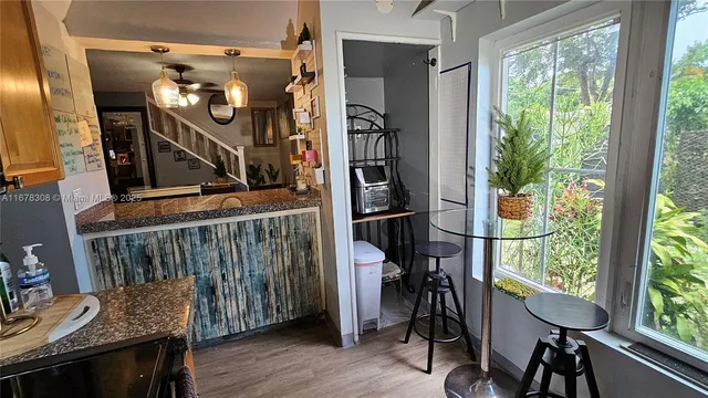 a view of entryway with furniture and a window