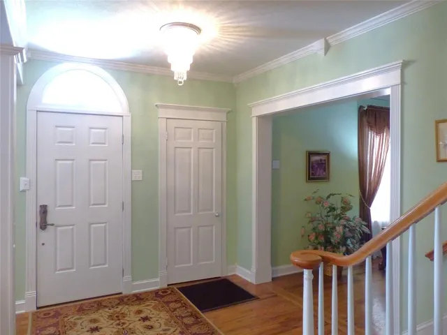 a view of entryway with wooden floor