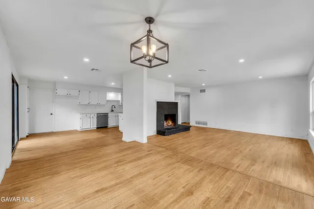 a large kitchen with cabinets and stainless steel appliances