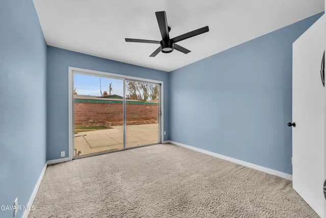 a view of livingroom with window and ceiling fan