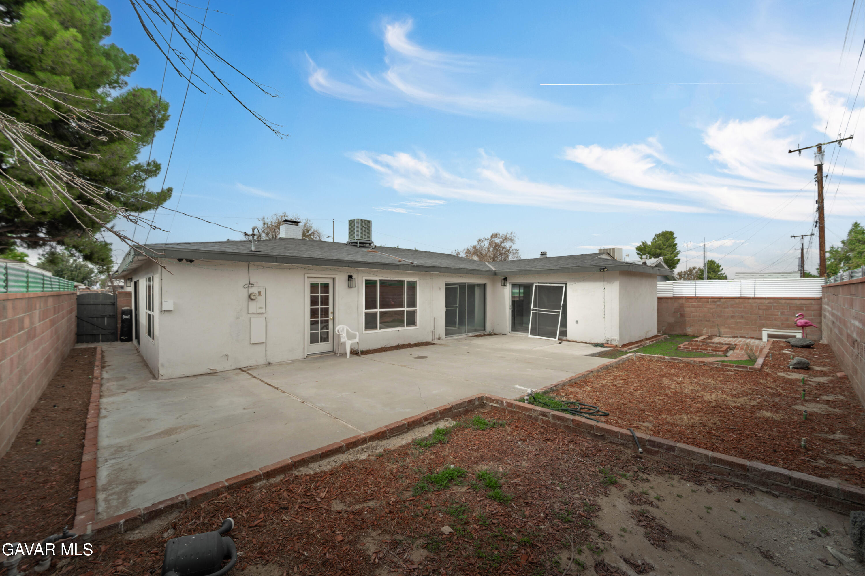 44526 Stanridge Avenue Lancaster, CA 93535 - Photo 7 of 26 a view of a house with a patio