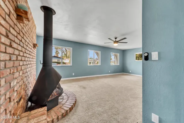 a view of room with window and ceiling fan