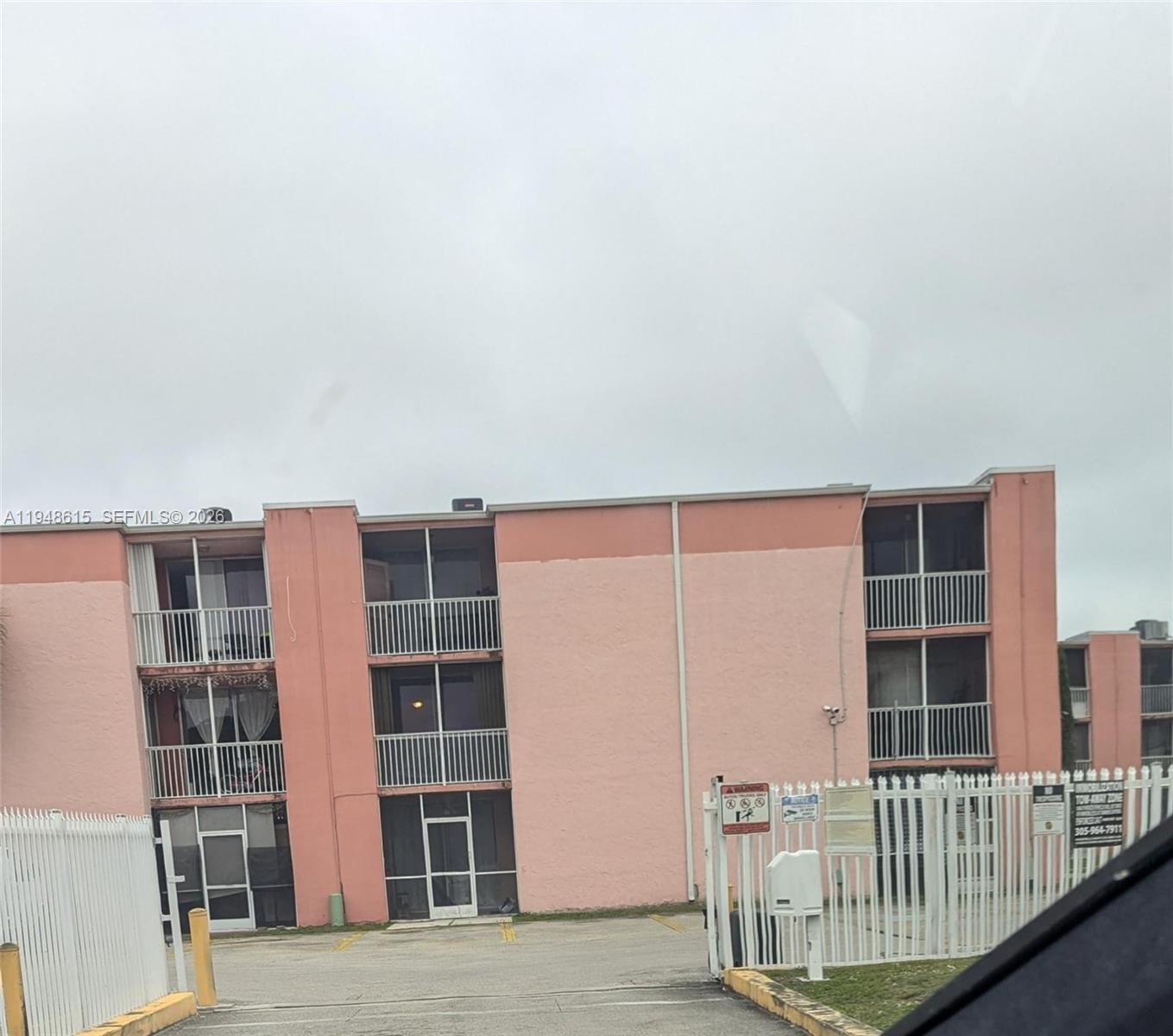 19715 Southwest 114th Avenue, Unit 357 Miami, FL 33157 - Photo 2 of 4 a view of front door with wooden floor and windows