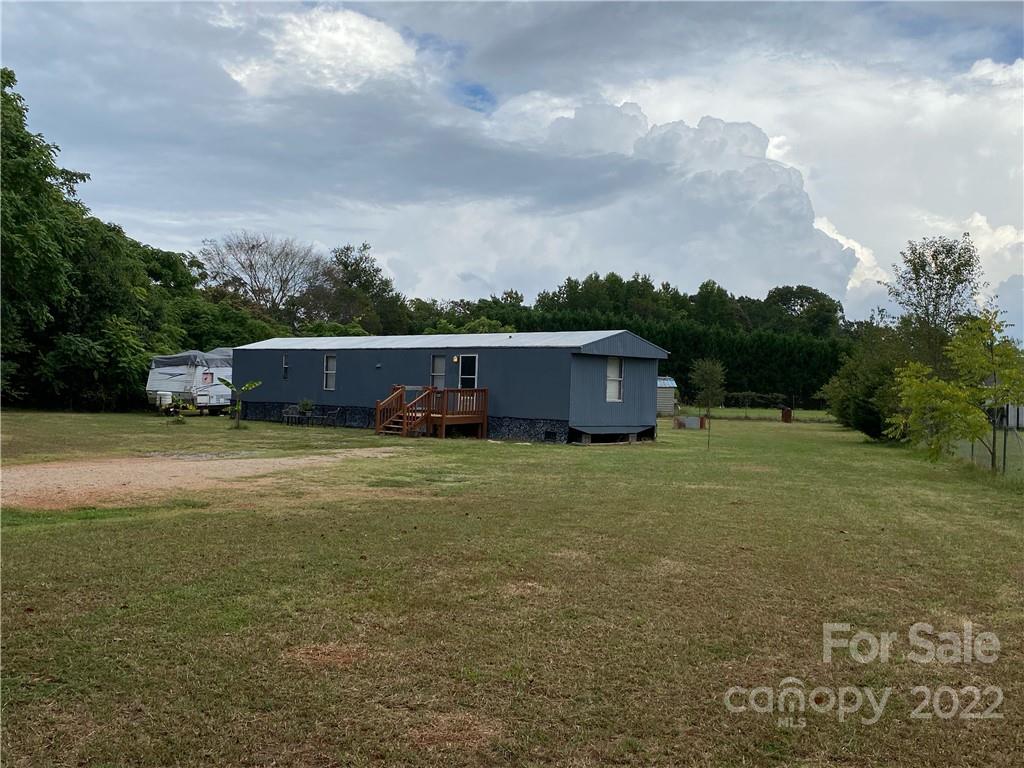 1454 Rhyne Road Clover, SC 29710 - Photo 1 of 8 a view of a big yard with large trees