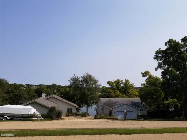 a view of house with outdoor space and garden