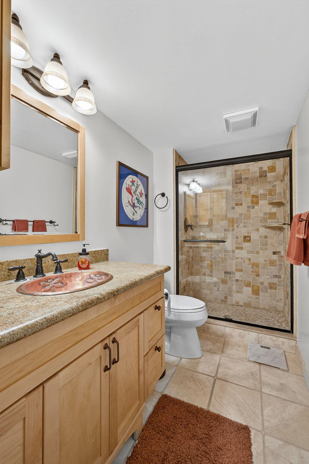 704 Clubhouse Circle Jupiter, FL 33477 - Photo 23 of 72 a bathroom with a granite countertop sink a toilet and a shower