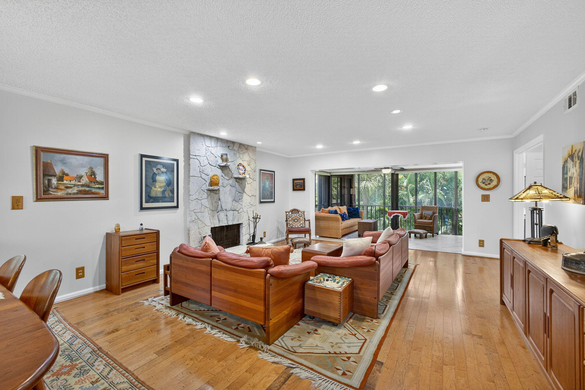 704 Clubhouse Circle Jupiter, FL 33477 - Photo 25 of 72 a living room with furniture a fireplace and a flat screen tv