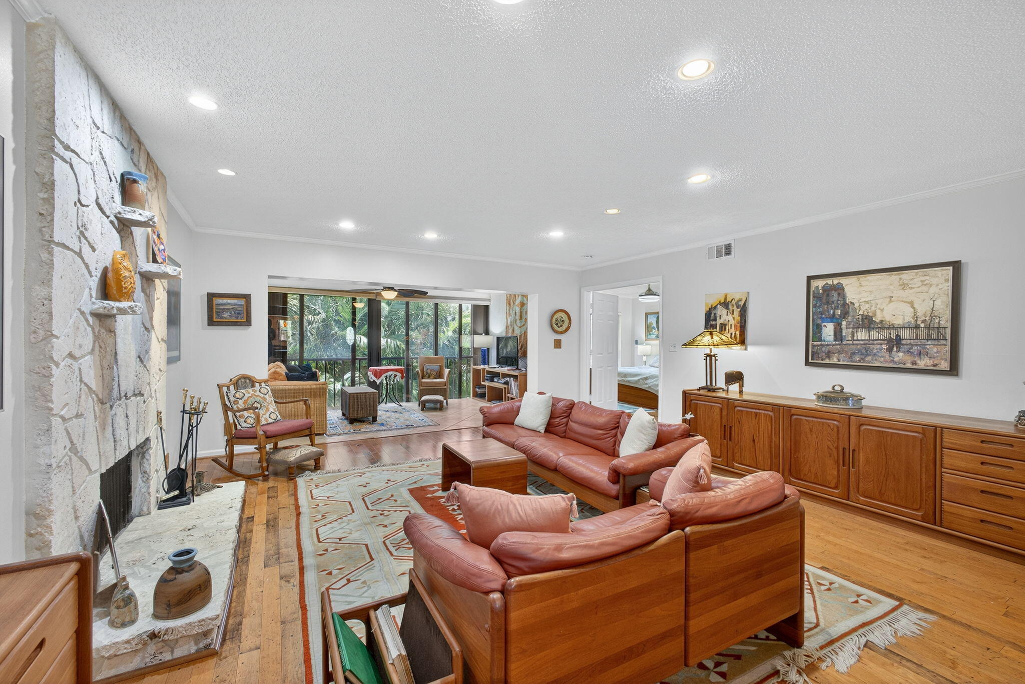 704 Clubhouse Circle Jupiter, FL 33477 - Photo 30 of 72 a living room with furniture and a fireplace