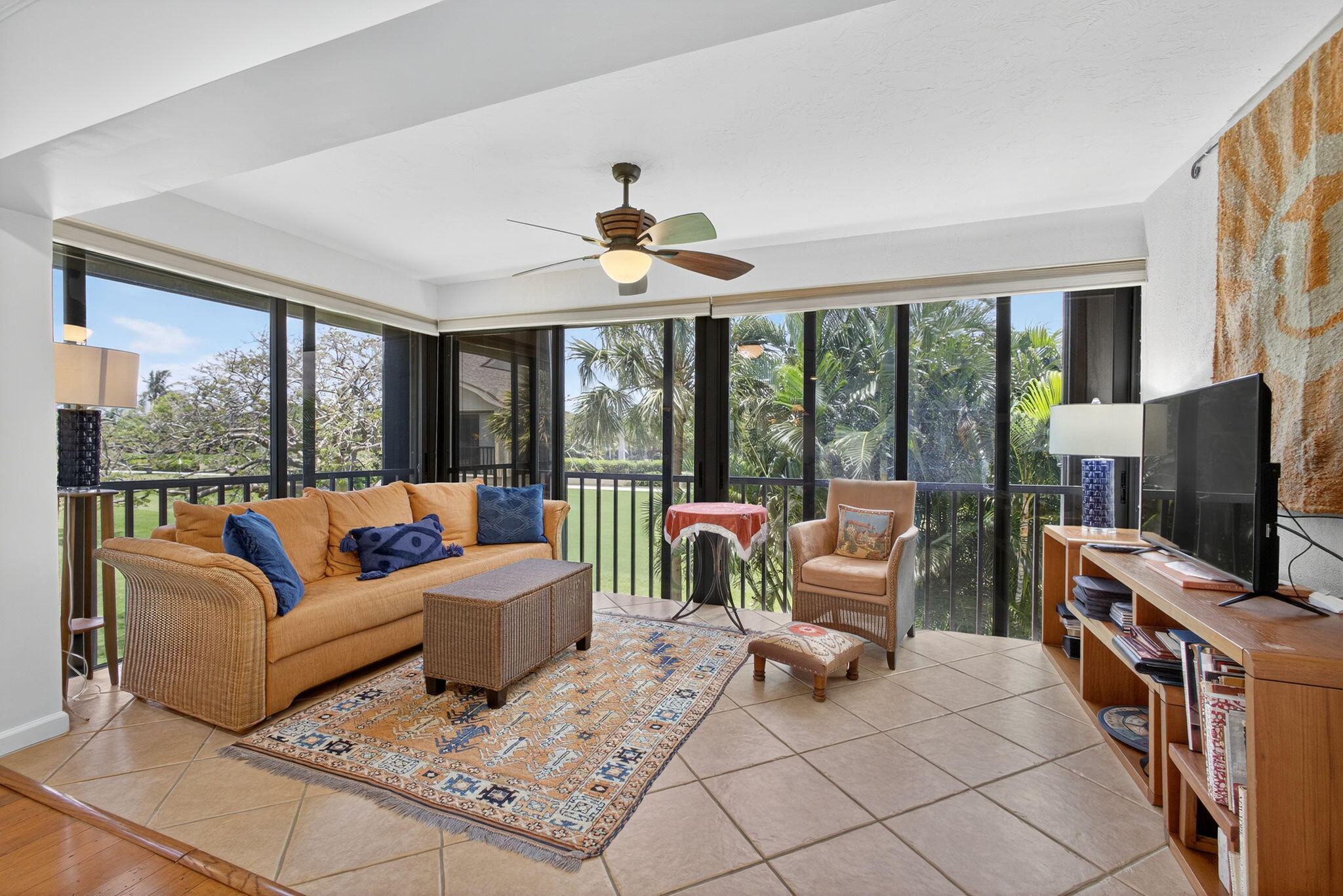 704 Clubhouse Circle Jupiter, FL 33477 - Photo 33 of 72 a living room with furniture a flat screen tv and a large window