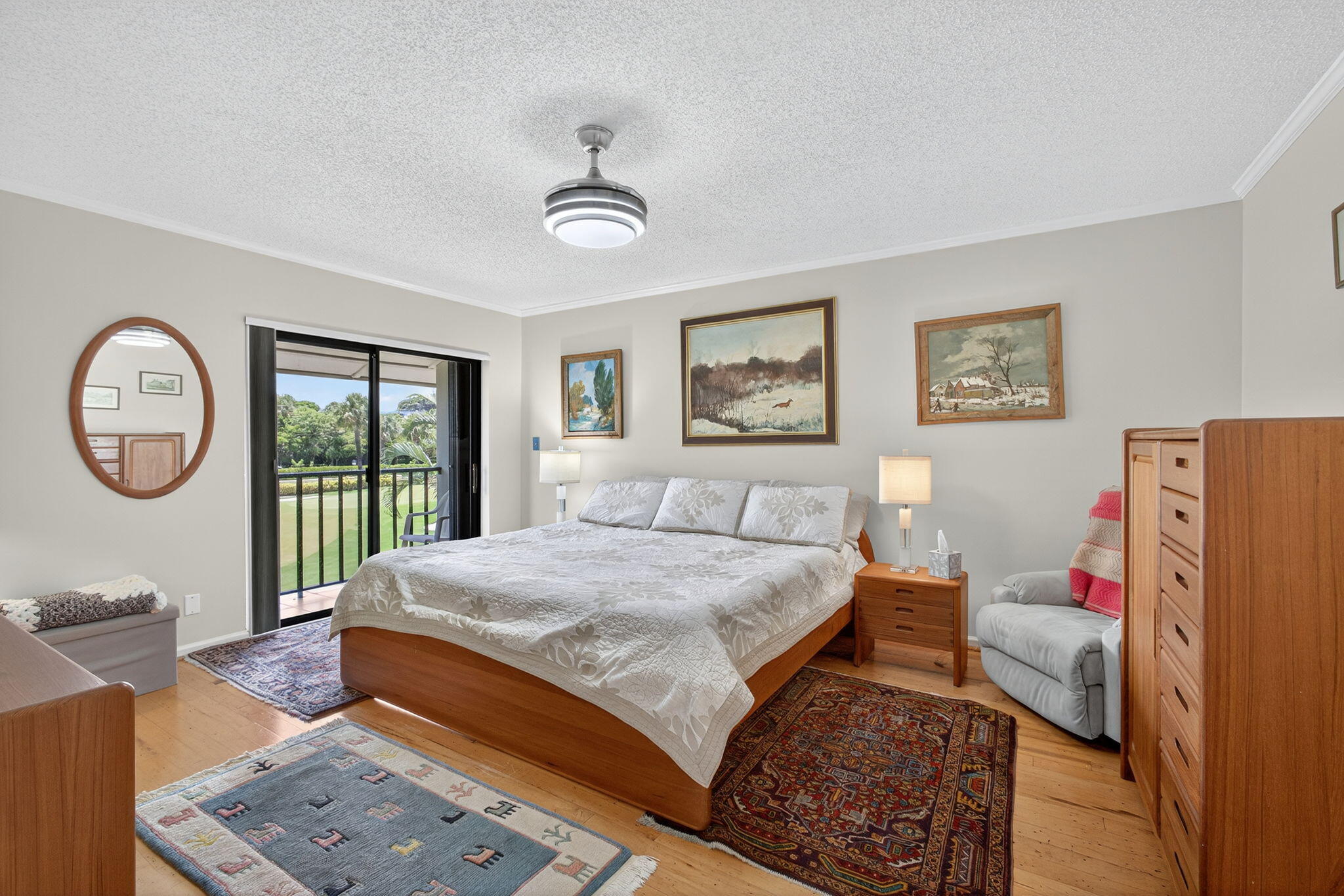 704 Clubhouse Circle Jupiter, FL 33477 - Photo 35 of 72 a bedroom with a bed a dresser next to a large window with the outer view